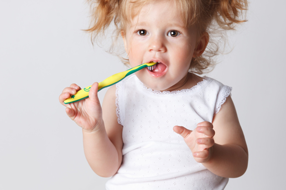 Baby brushing teeth